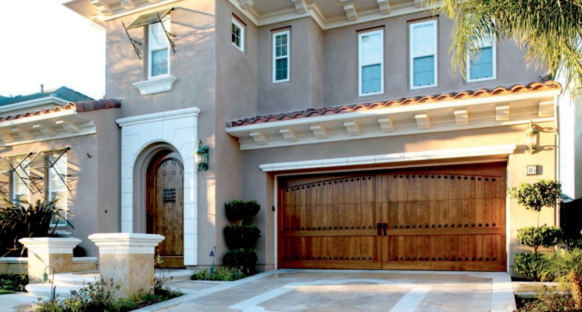 large home in san antonio with a ranch style brown garage door