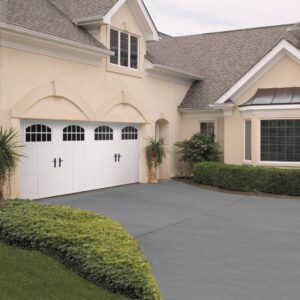 long white amarr classica, carriage style residential garage door on a cream colored home in san antonio