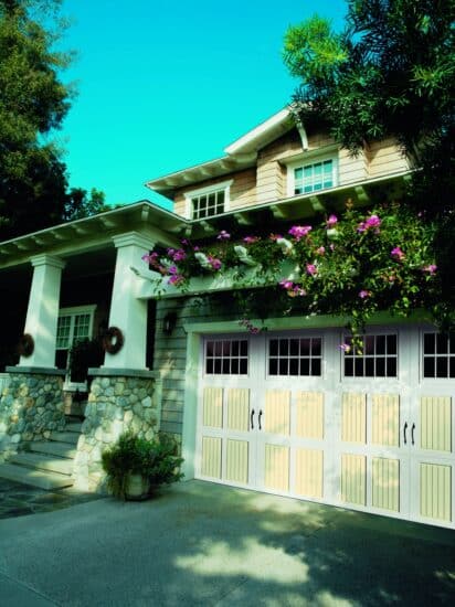 san antonio home with a faux wood grain style residential garage door