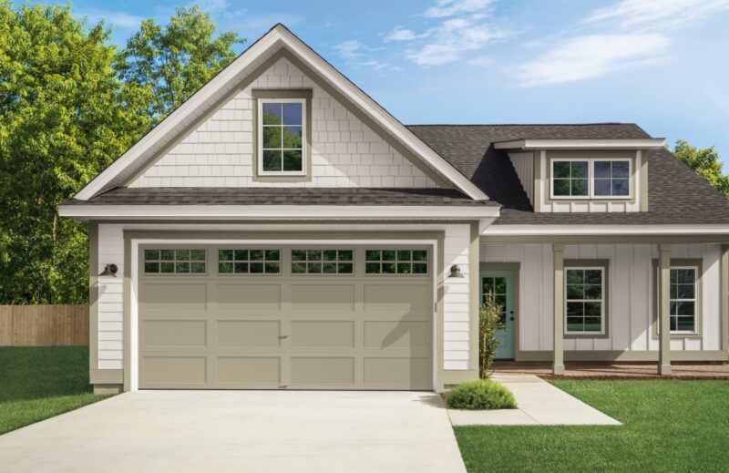 white home with a sandstone colored clopay bridgeport, traditional style residential steel garage door
