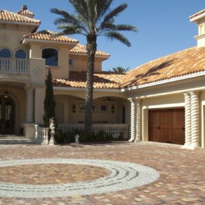 spanish style home with two clopay canyon ridge, faux wood grain style residential garage doors