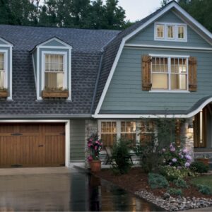 home in san antonio with a clopay canyon ridge, faux wood grain style residential garage door