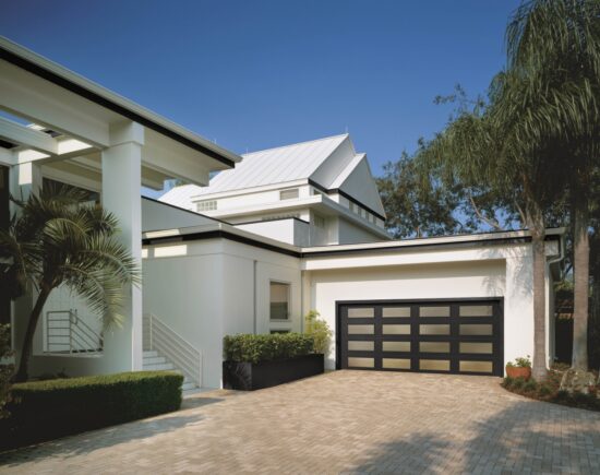 large modern home showing a clopay canyon ridge, modern style residential garage door