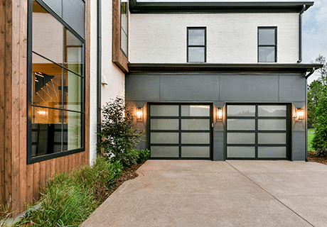 modern home with two clopay avante AX, modern style, full-view aluminum residential garage doors
