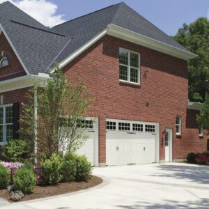 large red brick home with two white long square grilles clopay gallery, faux wood grain style, residential garage doors