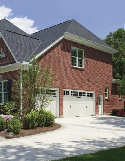 large red brick home with two white long square grilles clopay gallery, faux wood grain style, residential garage doors