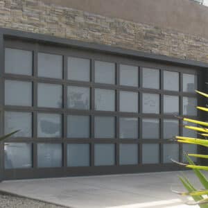 home with a martin elite athena, modern style, full-view aluminum residential garage door and plants by the door