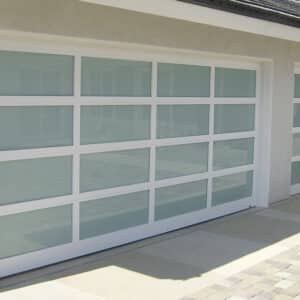 closeup of a home with two martin elite athena, modern style, full-view aluminum residential garage doors
