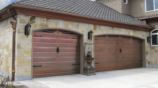 closeup of two martin elite copper, modern style residential garage doors