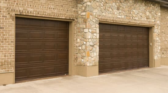 closeup of two martin elite copper, modern style residential garage doors