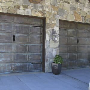 closeup of three martin elite copper, modern style residential garage doors