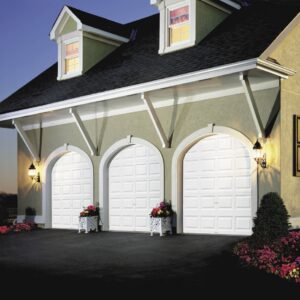 home in san antonio with three arched clopay premium classic series, traditional style residential garage doors