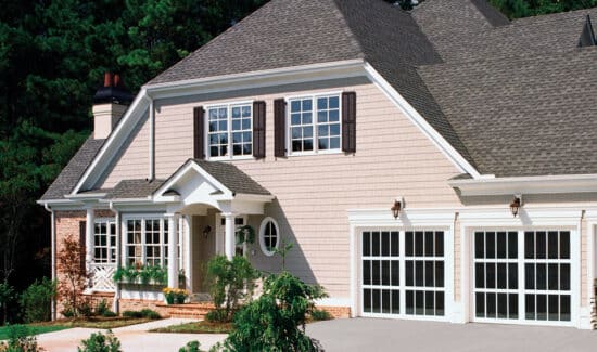 pink colored home with two raynor styleview, modern style, residential style garage doors with long paneled windows