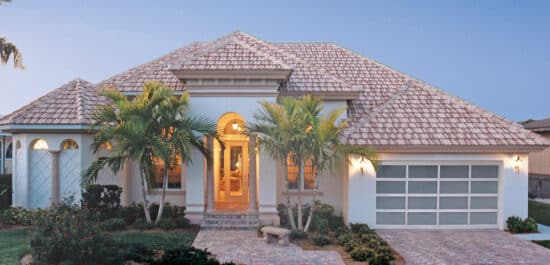 large home with tiled roff in San Antonio with a raynor styleview, modern style, residential style garage door