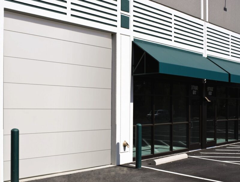 large commercial rolling door on the exterior of a commercial building
