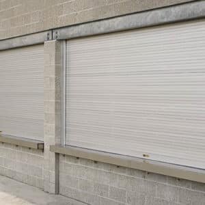 large counter shutter commercial rolling door on a brick wall in a commercial building