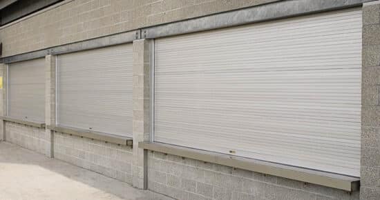 large counter shutter commercial rolling door on a brick wall in a commercial building