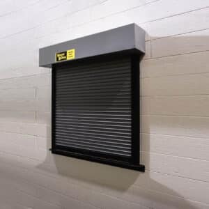 counter shutter commercial rolling door on a brick wall in a commercial building