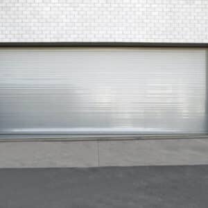 large commercial rolling door on the interior of a warehouse setting