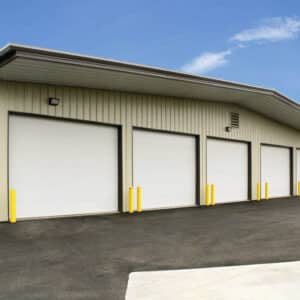 five commercial garage doors in a warehouse building