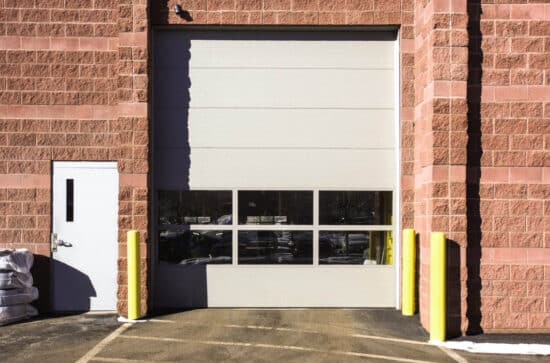 commercial garage door on a warehouse building