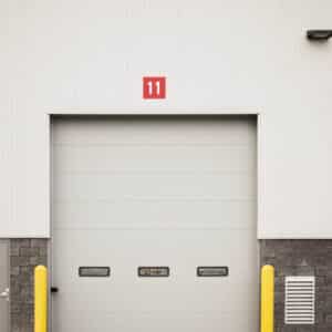 commercial garage door on a warehouse building