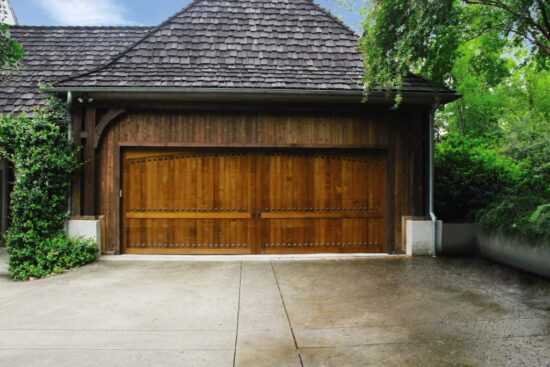 large custom wood residential garage door on san antonio home