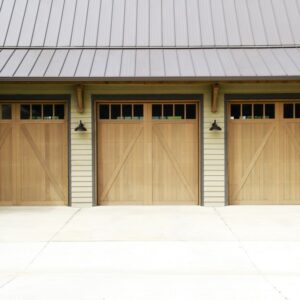 residential home with three custom wood garage doors in san antonio
