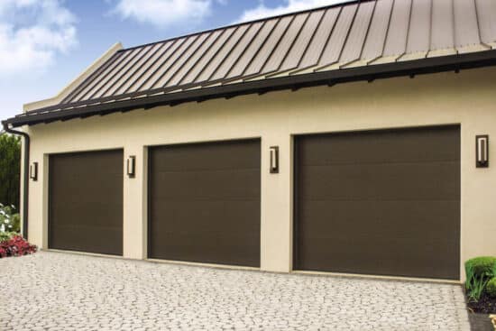 residential home with three modern style, flush contemporary panel garage doors