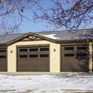 residential home with multiple faux wood grain style, sonoma/sonoma ranch panel garage doors