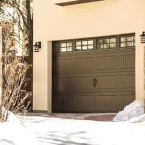 residential home with a faux wood grain style, sonoma/sonoma ranch panel garage doors