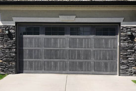 closeup of a sonoma gray wayne-dalton 9800, faux wood grain style, fiberglass residential garage door