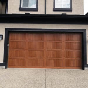 closeup of a sonoma red oak wayne-dalton 9800, faux wood grain style, fiberglass residential garage door