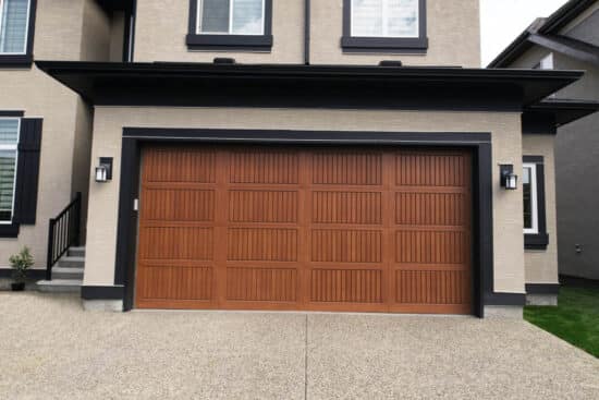 closeup of a sonoma red oak wayne-dalton 9800, faux wood grain style, fiberglass residential garage door