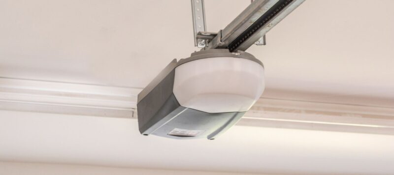 closeup of a garage door opener installed in a home